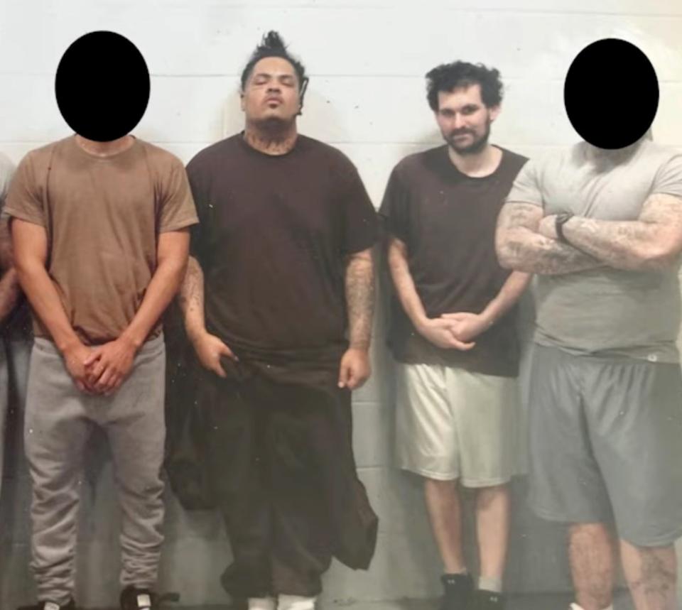 Sam Bankman-Fried is pictured in jail, alongside three other males. Obtained by Tiffany Fong