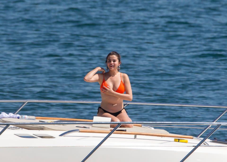 Selena rocked a black and orange bikini set and looked like she didn't have a care in the world following her kidney transplant. Source: Media Mode