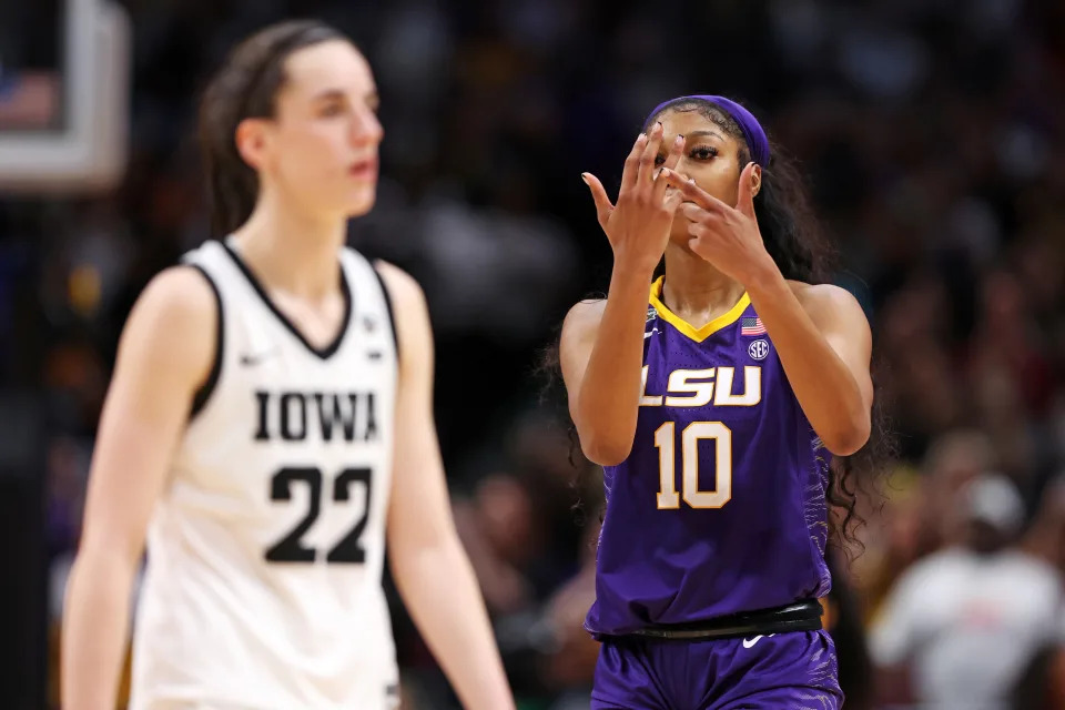 LSU's Angel Reese points to her ring finger toward Iowa's Caitlin Clark during the fourth quarter of the 2023 NCAA women's championship game at American Airlines Center in Dallas, on April 2, 2023. (Photo by Maddie Meyer/Getty Images)