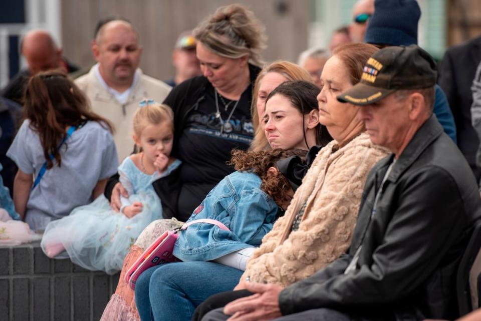Members of Steven Robin’s family during a ceremony dedicating commemorative stars in honor of Sergeant Steven Robin and Officer Branden Estorffe outside the new Bay St. Louis Police Department in Bay St. Louis on Thursday, Dec. 14, 2023.