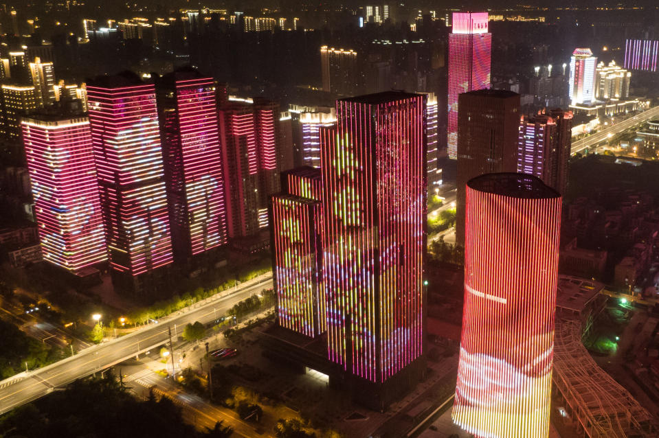 WUHAN, April 8, 2020 .Aerial photo taken on April 8, 2020 shows illuminated buildings in Wuhan, central China's Hubei Province. Wuhan, the megacity in central China, started lifting outbound travel restrictions from Wednesday after almost 11 weeks of lockdown to stem the spread of COVID-19. (Photo by Chen Min/Xinhua via Getty) (Xinhua/Cheng Min via Getty Images)