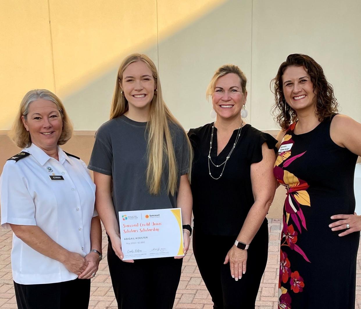 Abigail Koester of Sarasota Military Academy receives a Suncoast Credit Union scholarship. She is joined by Christina Bowman, CEO of SMA, Heather Koester, and Heather Ferrigno of the Education Foundation of Sarasota County.