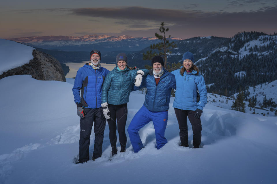 This photo provided by Keith Sutter shows the 4 Forlorn Hope Expedition members from left to right, Tim Twietmeyer, Jennifer Hemmen, Bob Crowley, and Elke Reimer near the Donner Pass on Nov. 22, 2020. The four veteran ultrarunners from Northern California are setting out on snowshoes to retrace the footsteps of the pioneers who braved the worst blizzard in a century to escape over the top of what's now called Donner Pass through the Emigrant Gap northwest of Lake Tahoe. (Keith Sutter via AP)