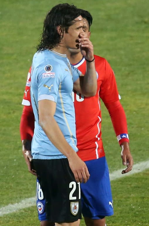 Chile's defender Gonzalo Jara (in red) is seen provoking Uruguay's Edinson Cavani during their Copa America quarter-final match in Santiago, on June 24, 2015