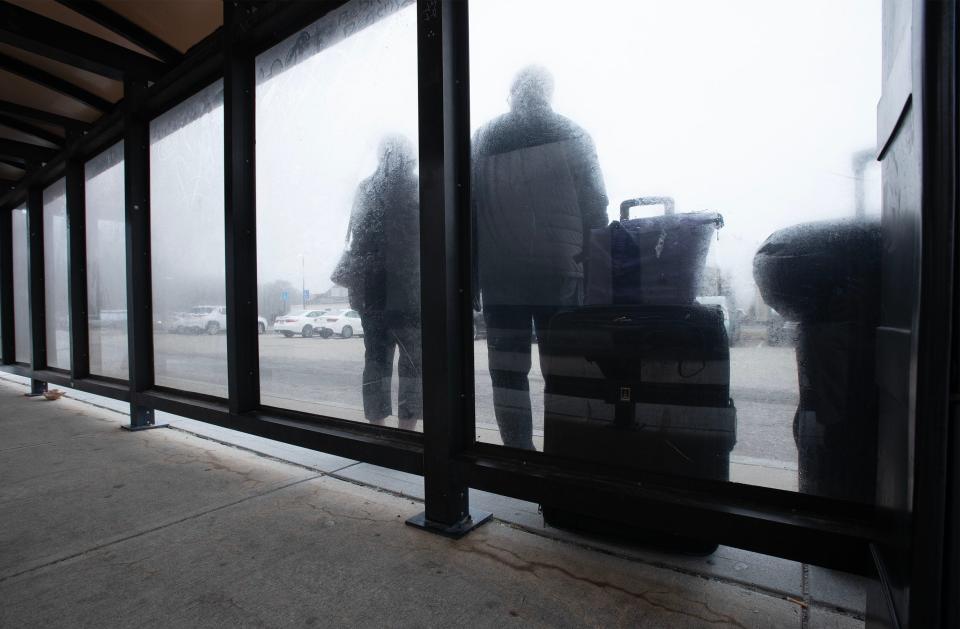 Passengers waiting out a damp morning at the park and ride in West Barnstable for the next bus heading to Boston. The Cape Cod Metropolitan Planning Organization has temporarily removed the expansion project from its fiscal 2024-2028 Transportation Improvement Plan because of design delays.