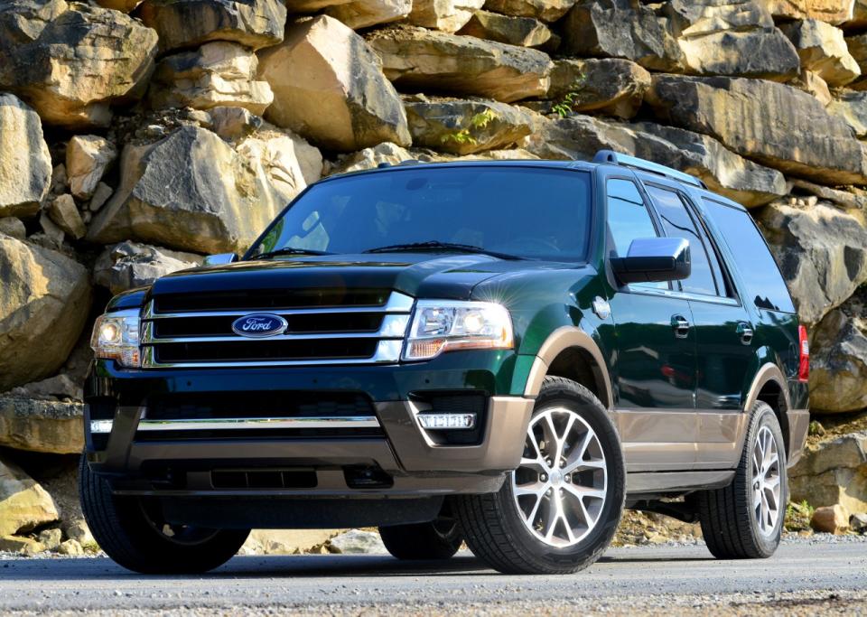 A green 2016 Ford Expedition, a large SUV.