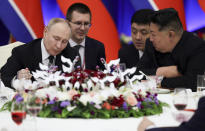 Russian President Vladimir Putin, left, and North Korea's leader Kim Jong Un attend a State Reception after their talks in Pyongyang, North Korea, on Wednesday, June 19, 2024. (Gavriil Grigorov, Sputnik, Kremlin Pool Photo via AP)