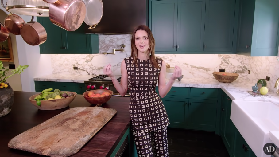 Kendall Jenner standing in her kitchen