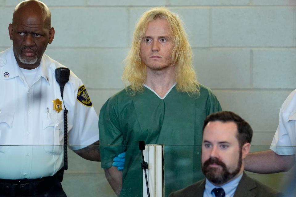 Jared Ravizza, of Chilmark, Mass., center, stands during his arraignment, Tuesday, May 28, 2024, at Plymouth District Court, in Plymouth, Mass., as his defense attorney Sean O'Neill, right, looks on. Ravizza was arraigned assault charges. (AP Photo/Steven Senne, Pool)