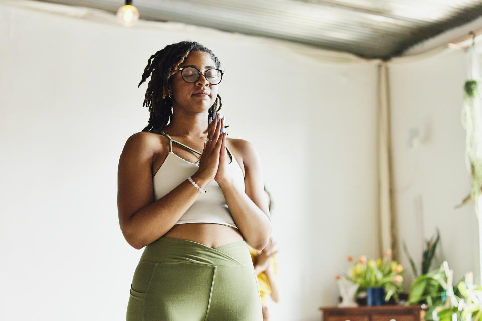 Woman meditating after yoga. (Getty Images)