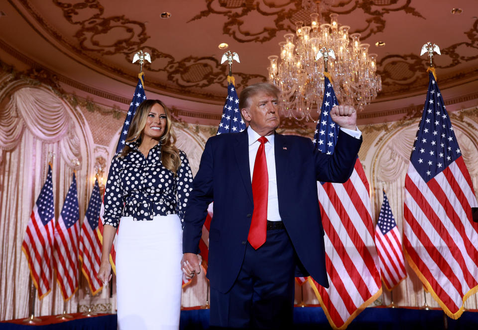 Former U.S. President Donald Trump and former first lady Melania Trump stand together during an event at his Mar-a-Lago home on November 15, 2022.