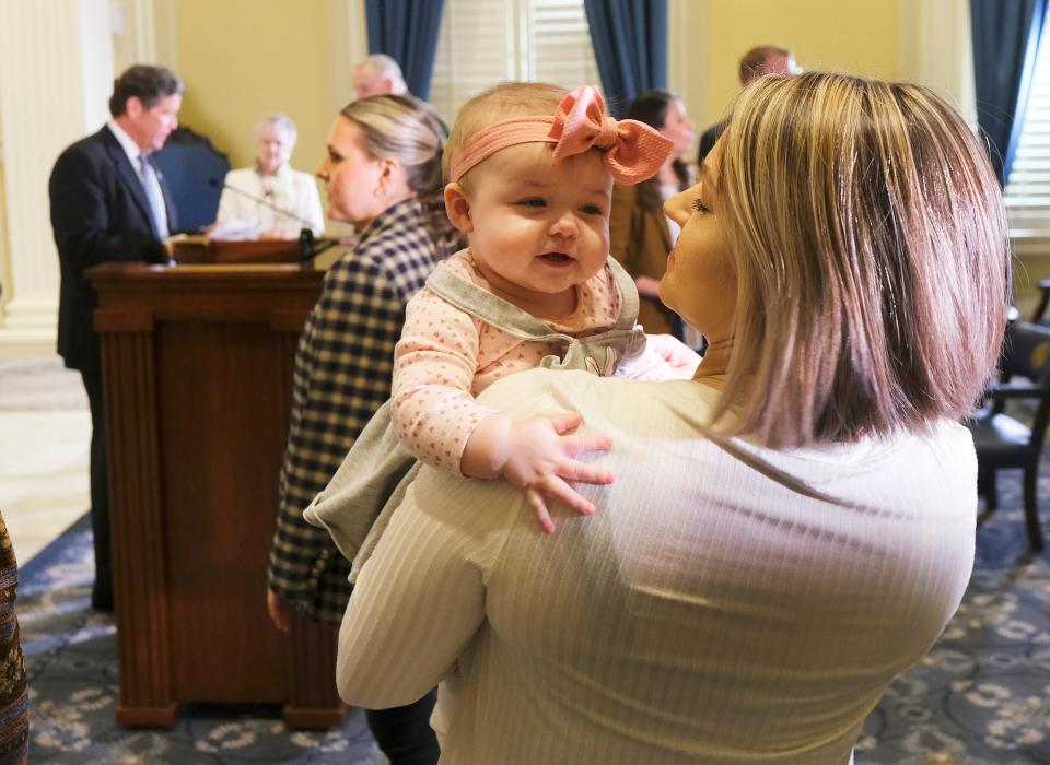 Ciera Pollard holds her daughter, Camila Pollard, 7 months, after a press conference to announce the expansion of SoonerCare for pregnancy and postpartum care at the Oklahoma Capitol Monday, March 27, 2023