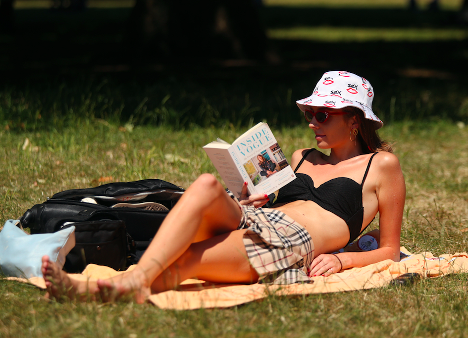 <em>Lottie Edwards lies in the sun in Green Park London, as a heatwave which could produce the hottest temperatures this year is sweeping across the UK (PA)</em>