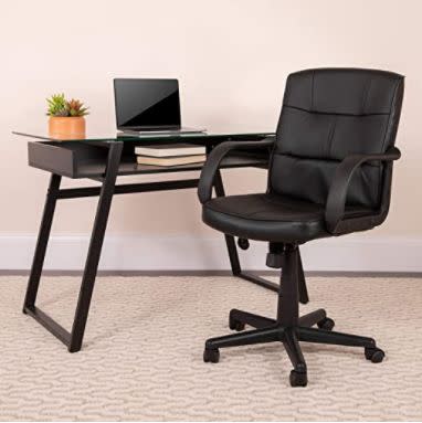 Get this <a href="https://amzn.to/2H4J0YM" target="_blank" rel="noopener noreferrer">﻿black leather swivel office chair on sale for $76</a> (normally $110) on Amazon.