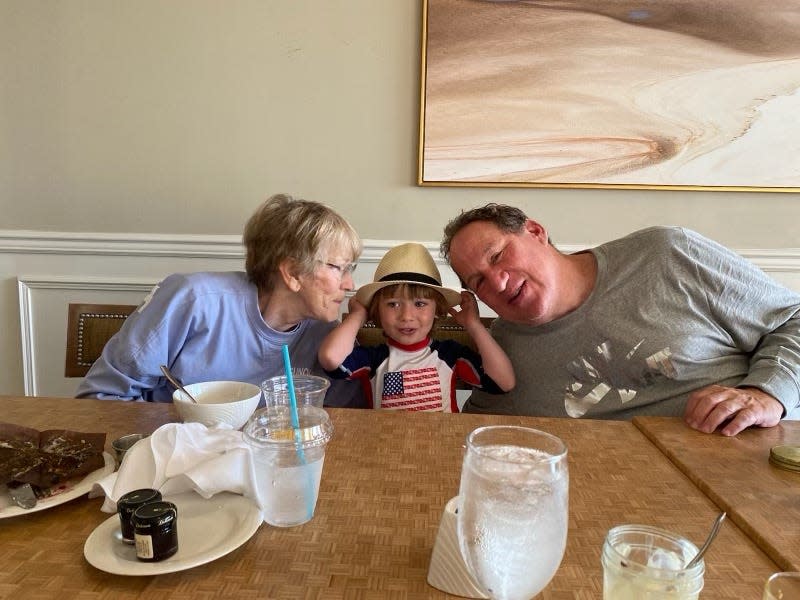 Columbus Attorney Michael Oser with his wife Nadine Van Dyke and grandson Nathanael Hudspeth.