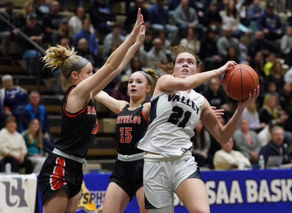 Putnam Valley's Eva DeChent (21) drives past Waterloo's Addison Bree (5) and Maci Mueller (15) in the girls NYSPHSAA Class B championship game at Hudson Valley Community College in Troy, on Saturday, March 18, 2023.