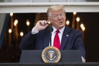 President Donald Trump listens to the music before speaking during a "Rolling to Remember Ceremony," to honor the nation's veterans and POW/MIA, from the Blue Room Balcony of the White House, Friday, May 22, 2020, in Washington. (AP Photo/Alex Brandon)