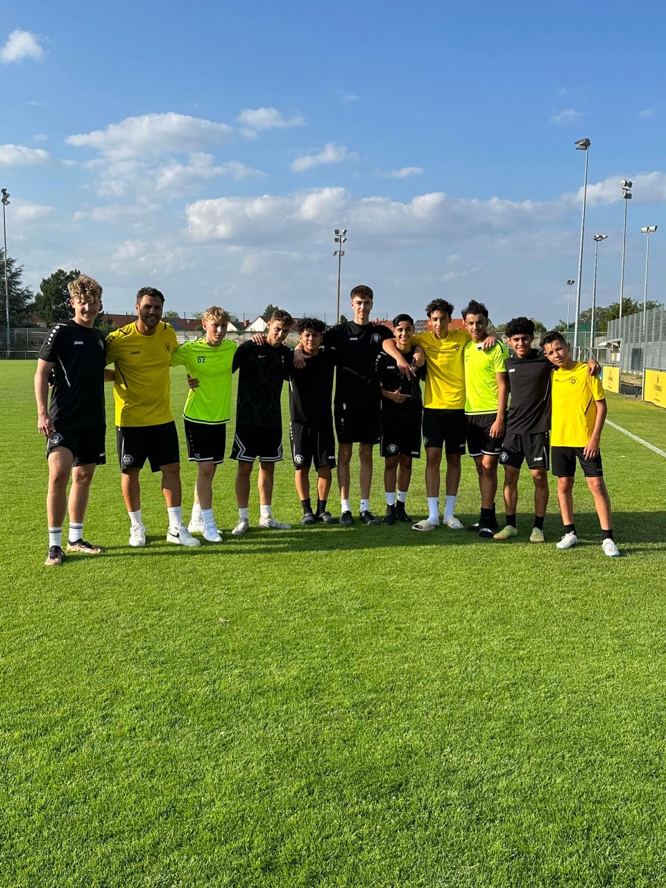 Angelo Vieyra and Giovanni Medina pose in photo alongside other youth soccer players who participated in the Moki Fussballakademie youth soccer trial in Germany.