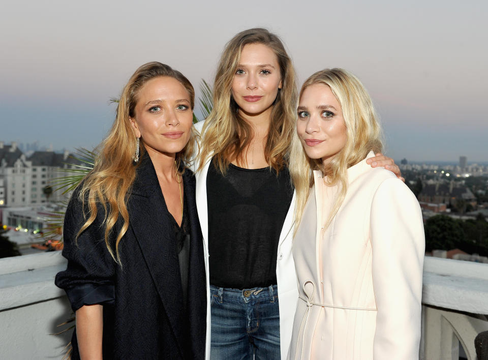 Mary-Kate Olsen, Elizabeth Olsen and Ashley Olsen at an event together in 2016.