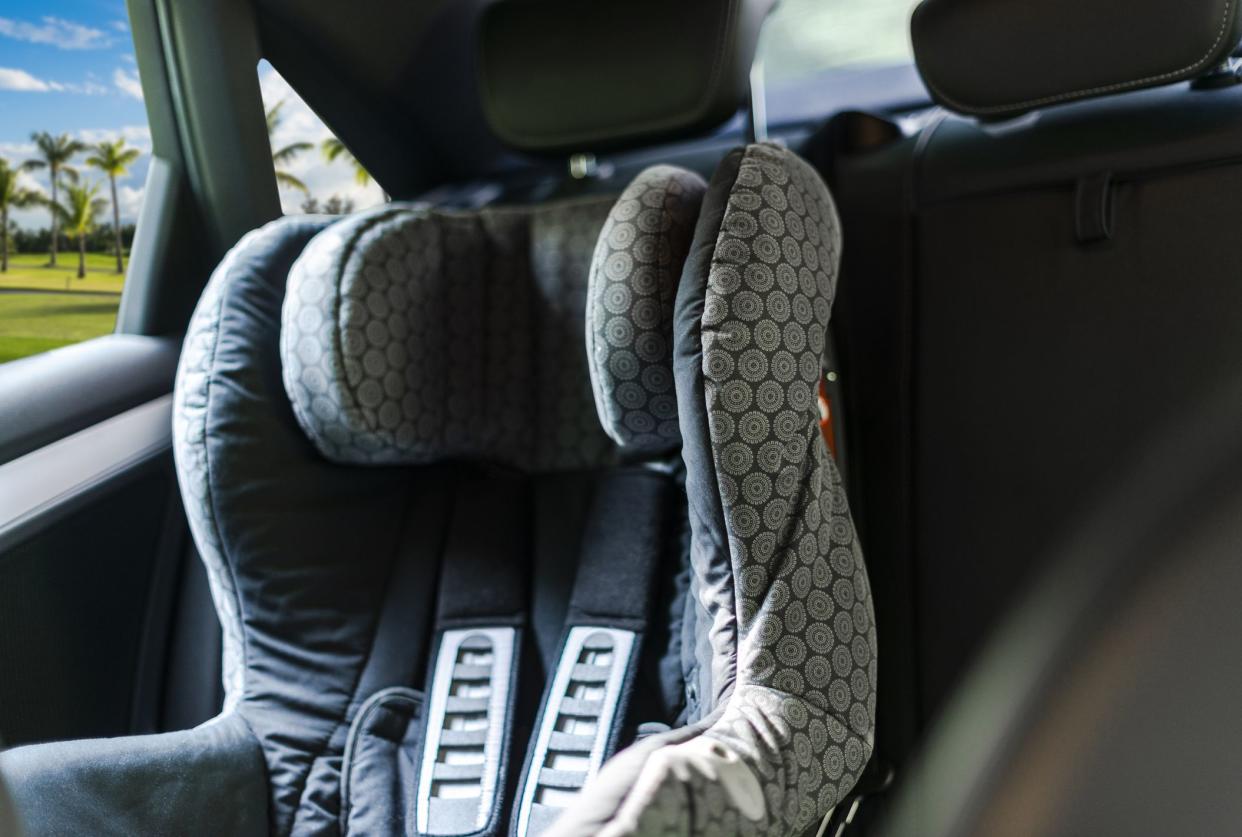 Child safety seat in the back of the car. Baby car seat for safety. Car interior. Car detailing