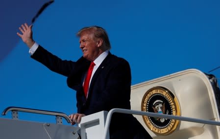 U.S. President Donald Trump reacts as he deplanes from Air Force One in Cleveland, Ohio