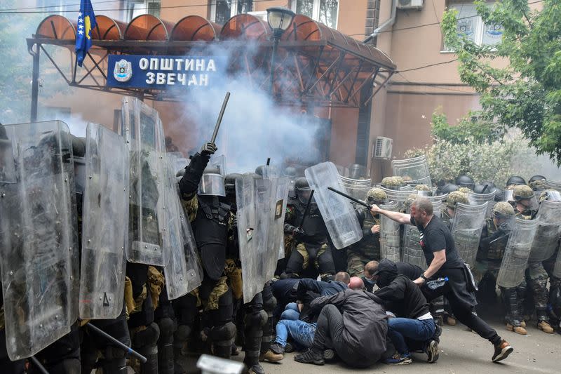 NATO Kosovo Force (KFOR) soldiers clash with local Kosovo Serb protesters in the town of Zvecan