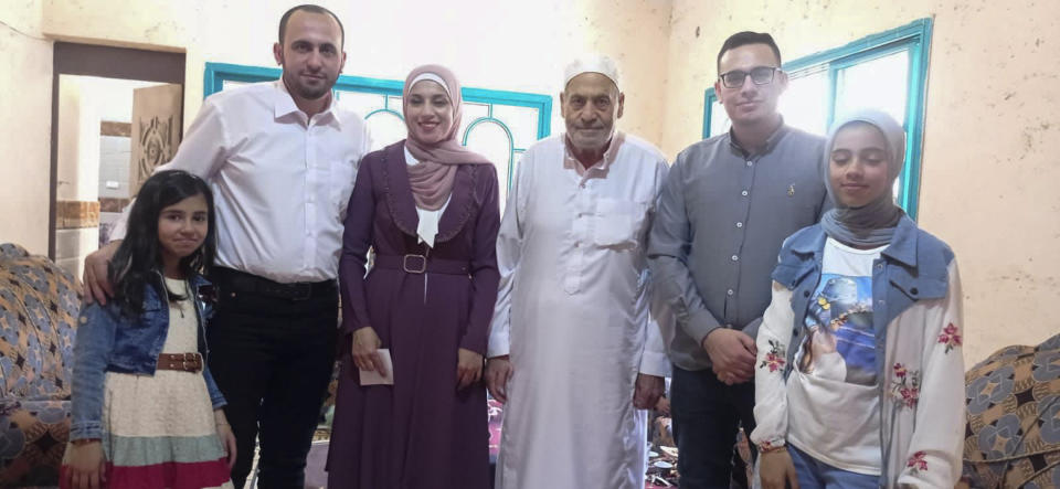 This April 21, 2023 photo provided by Ahmed al-Naouq shows his niece Tala al-Naouq, brother Mohammed al-Naouq, Alaa al-Naouq, his father Nasri al-Naouq, Mahmoud al-Naouq and Dima al-Naouq in Deir Al Balah, Gaza. Entire generations of Palestinian families in the besieged Gaza Strip have been killed in airstrikes in the ongoing Hamas-Israel war. The unprecedented violence has raised troubling questions about Israeli tactics. Ahmed al-Naouq says none of his 21 family members, including 13 children, killed in an Israeli strike on his family's home belonged to Hamas. (Courtesy of Ahmed al-Naouq via AP)