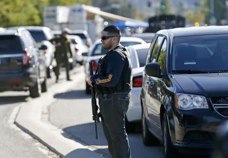 Police officers secure the area after at least one person opened fire at a social services agency in San Bernardino, California December 2, 2015. REUTERS/Mario Anzuoni