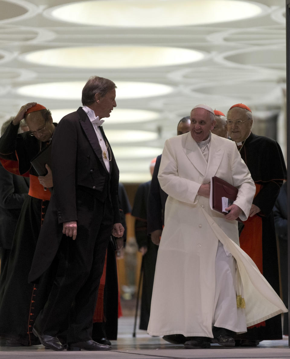 Pope Francis leaves at the end of the afternoon session of an extraordinary consistory in the Synod hall at the Vatican City, Thursday, Feb. 20, 2014. Cardinals from around the globe have begun discussing some of the most contentious issues in the church amid findings from Vatican-mandated surveys that most Catholics reject church teaching on contraception, divorce and homosexuality. Pope Francis opened the two-day meeting Thursday by urging his cardinals to find "intelligent, courageous" ways to help families under threat today without delving into case-by-case options to get around Catholic doctrine. (AP Photo/Alessandra Tarantino)