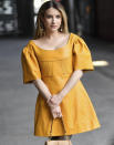 <p>Dressed in an orange leather dress, Emma Roberts strikes a pose as she leaves the Chloe runway show on March 2 during Paris Fashion Week. </p>