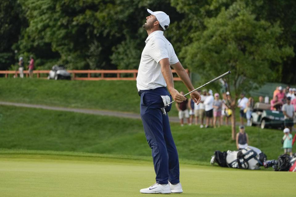 Scottie Scheffler reacts after missing a putt on the 12th green during the third round of the Travelers Championship golf tournament at TPC River Highlands, Saturday, June 22, 2024, in Cromwell, Conn. (AP Photo/Seth Wenig)