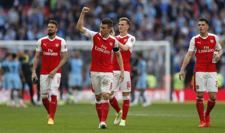 Britain Football Soccer - Arsenal v Manchester City - FA Cup Semi Final - Wembley Stadium - 23/4/17 Arsenal's Laurent Koscielny, Olivier Giroud, Rob Holding and Granit Xhaka celebrate after the match Action Images via Reuters / John Sibley Livepic