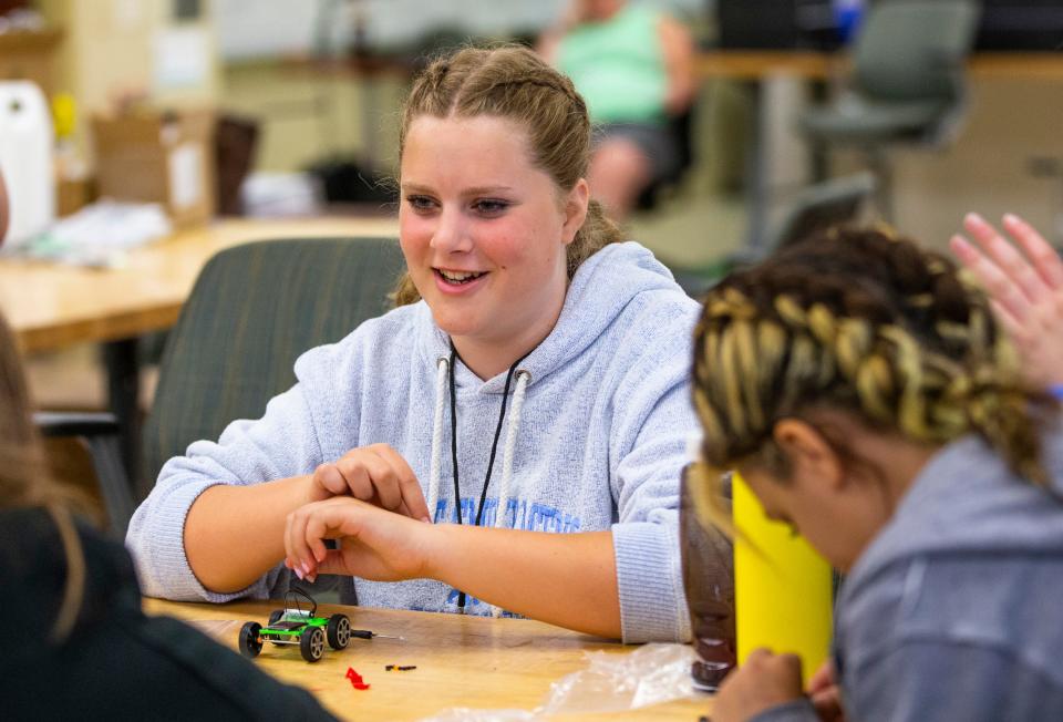 Ainsley Gray, 13, works on a solar-powered car during the GE Girls STEM Camp Wednesday, June 22, 2022, at Notre Dame.