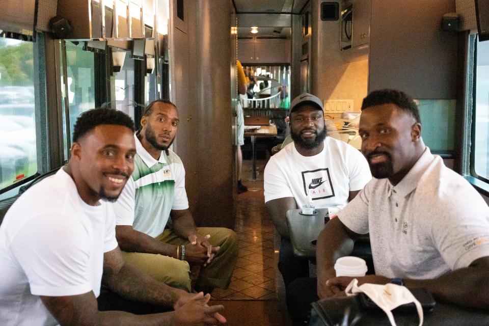 From left to right, Morgan Burnett, Ryan Grant, Nick Collins and James Jones sit on the bus during the Packers Road Trip at Bellin Hospital, Thursday, July 22, 2021, Green Bay, Wis.