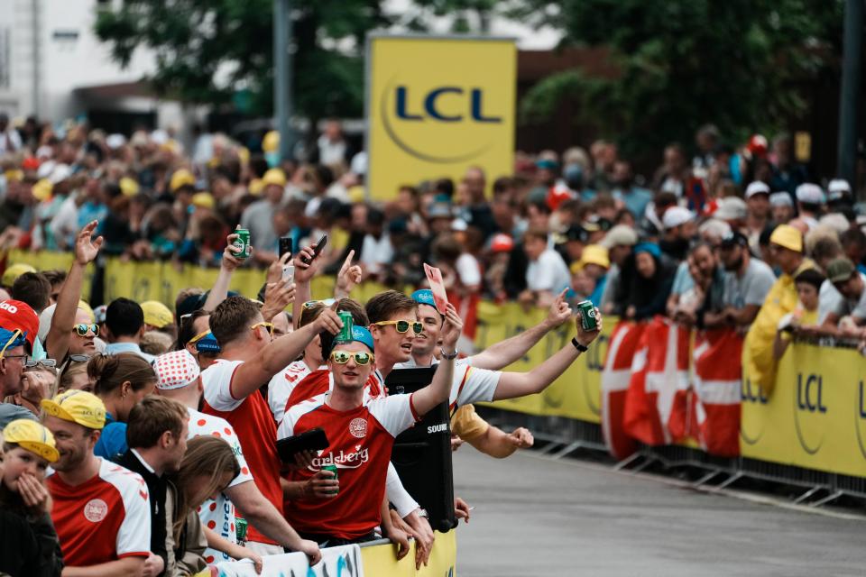 Fans cheer prior to the first stage of the Tour de France (AP)