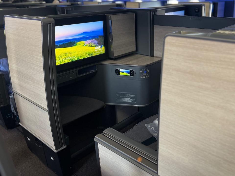 "The Room" business class seat with its privacy door open.