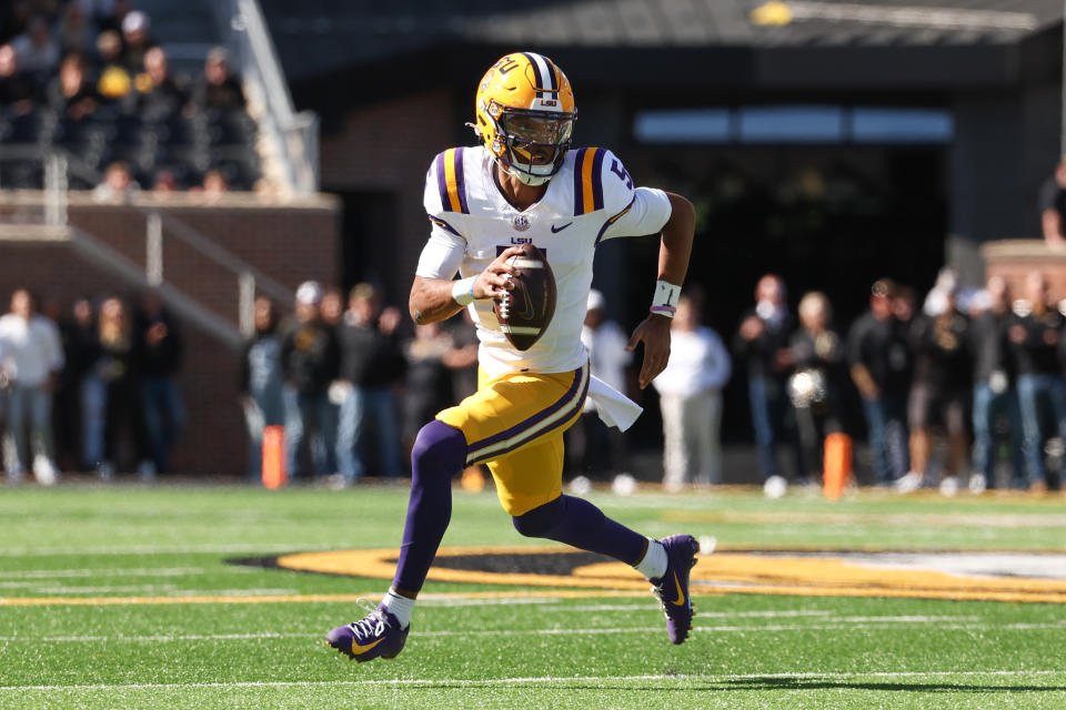 COLUMBIA, MO - OCTOBER 07: LSU Tigers quarterback Jayden Daniels (5) rolls out in the first quarter of an SEC football game between the LSU Tigers and Missouri Tigers on Oct 7, 2023 at Memorial Stadium in Columbia, MO. (Photo by Scott Winters/Icon Sportswire via Getty Images)