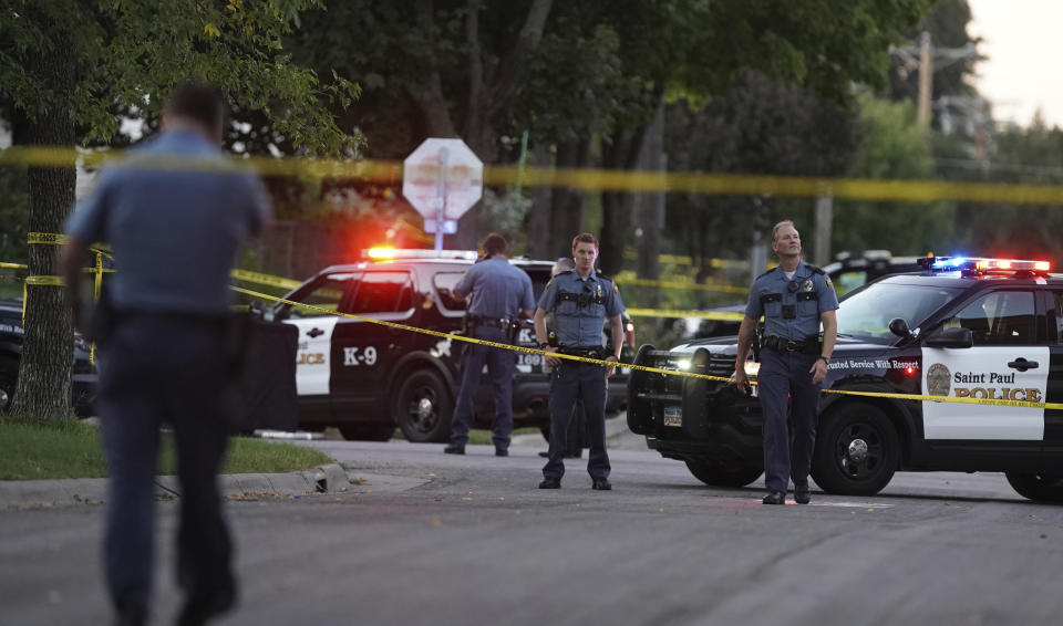 Police officers work the scene of a shooting near North Griggs and Thomas Ave West in St. Paul, Minn., Sunday, Sept. 15, 2019. (Richard Tsong-Taatarii/Star Tribune via AP)