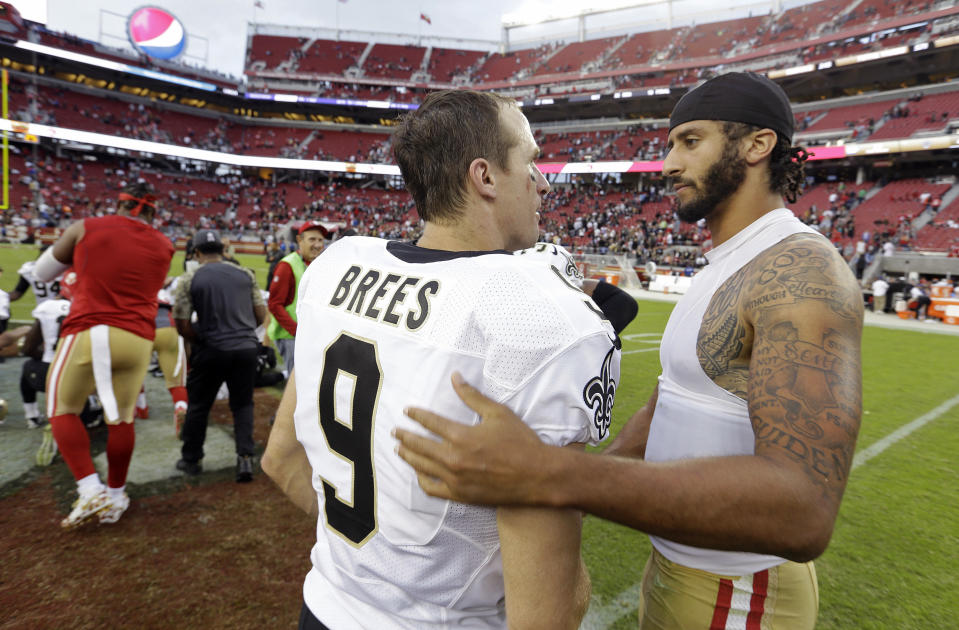 FILE - In this Nov. 6, 2016, file photo, San Francisco 49ers quarterback Colin Kaepernick, right, is greeted by New Orleans Saints quarterback Drew Brees at the end of an NFL football game in Santa Clara, Calif. As athletes and sports organizations around the world speak out against racial injustice in the wake of George Floyd’s death, Drew Brees drew sharp criticism after he reiterated his opposition to Colin Kaepernick’s kneeling during the national anthem in 2016. (AP Photo/D. Ross Cameron, File)