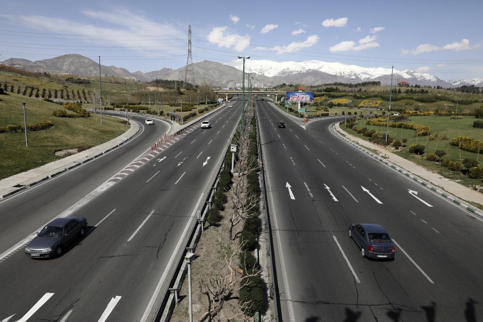 Cars drive in a highway in northern Tehran, Iran, Friday, March 20, 2020, on the first day of Iranian New Year, called Nowruz, or "New Day" in Farsi, the Persian holiday marking the the spring equinox. The new coronavirus has cut into the ancient Nowruz and has further slowed the Islamic Republic's economy. (AP Photo/Vahid Salemi)