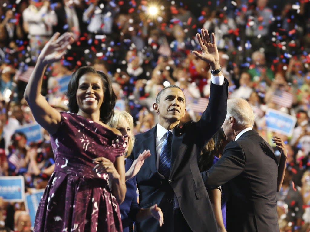 Barack and Michelle Obama wave to the crowd during the final session of the Democratic National Convention in Charlotte (Reuters)