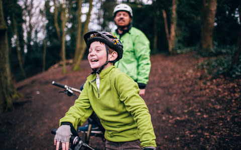 Child, enjoying wild cycling - Credit: Sally Anscombe, Digital Vision