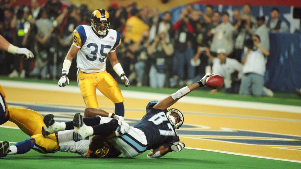 Dyson is tackled by St. Louis linebacker Mike Jones just short of the goal line on the last play of Super Bowl XXXIV. The Rams beat the Titans 23-16. - Mike Zarrilli/Getty Images