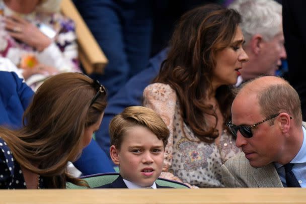 PHOTO: The Duke and Duchess of Cambridge talk to their son Prince George as they attend the men's singles final tennis match between Serbia's Novak Djokovic and Australia's Nick Kyrgios at the 2022 Wimbledon Championships in London, July 10, 2022. (Alastair Grant/AP)