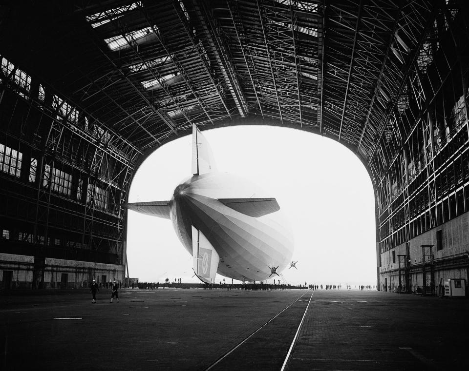 <p>The German-built zeppelin Hindenburg is shown from behind, with the Swastika symbol on its tail wing, as the dirigible is partially enclosed by its hangar at the U.S. Navy Air Station in Lakehurst, N.J., May 9, 1936. (AP Photo) </p>