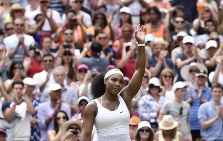 Serena Williams of the U.S.A. celebrates after winning her match against Venus Williams of the U.S.A. at the Wimbledon Tennis Championships in London, July 6, 2015. REUTERS/Toby Melville