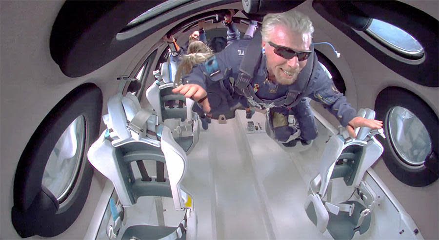 Richard Branson, floading with his crewmates in the cabin of Virgin Galactic's VSS Unity spaceplane. / Credit: Virgin Galactic