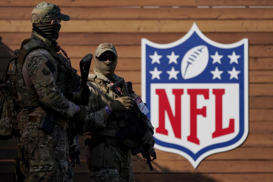 Sheriff's department officers work crowd control outside Raymond James Stadium before the NFL Super Bowl 55 football game between the Kansas City Chiefs and Tampa Bay Buccaneers, Sunday, Feb. 7, 2021, in Tampa, Fla. (AP Photo/Gregory Bull)