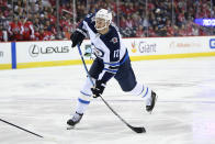 FILE - In this March 10, 2019, file photo, Winnipeg Jets right wing Kevin Hayes (12) shoots the puck during the second period of an NHL hockey game against the Washington Capitals, in Washington. The Philadelphia Flyers have signed center Kevin Hayes to a $50 million, seven-year contract that’s worth $7.14 million per season. Hayes should step in as the Flyers’ new No. 2 center behind Sean Couturier. General manager Chuck Fletcher announced the deal Wednesday, June 19, 2019, file photo, saying the 6-foot-5, 216-pound Hayes “plays a smart, two-way game and is just entering the prime of his career.” Philadelphia acquired Hayes’ negotiating rights from Winnipeg for a fifth-round pick during the Stanley Cup Final. (AP Photo/Nick Wass, File)