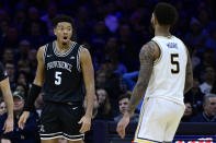 Providence's Ed Croswell, left reacts after a foul called during the second half of an NCAA college basketball game against Villanova, Sunday, Jan. 29, 2023, in Philadelphia. (AP Photo/Derik Hamilton)